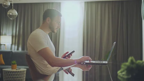 Man chatting online while working Stock-Footage 234347519