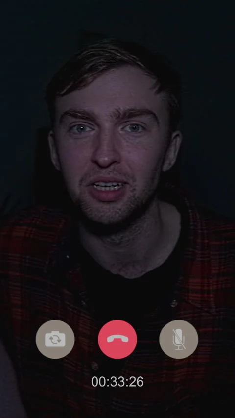 Man Chatting on Video Call while Creepy Lights Flashing at Home Stock Footage 311566201