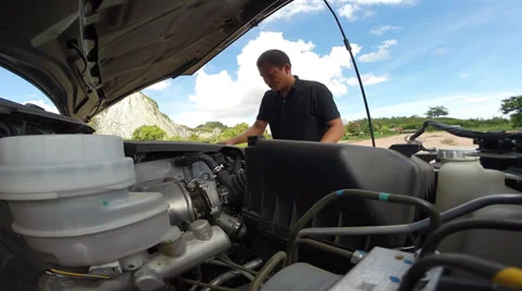 Man to check car engine before driving Stock Footage 38456943