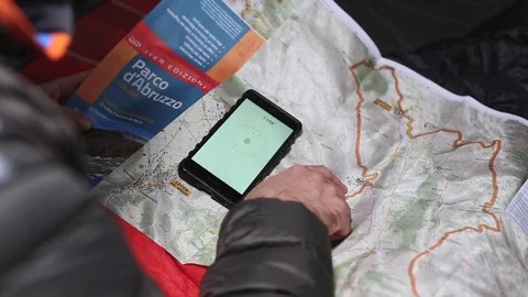 Man check the paper map Stock Footage 84386659