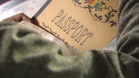 The man checked the overseas visa in the document pouch Stock Footage 276516460