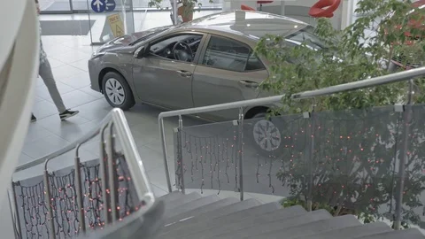 Man in checkered shirt looking inside car. Stock Footage 99773339