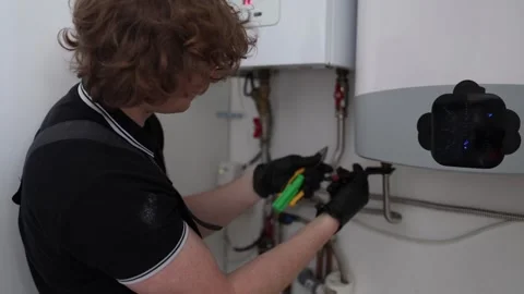 Man checking apartment boiler Stock Footage 335044264