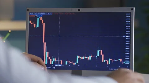 Man checking Bitcoin price chart on digital stock market on laptop, cryptocurren Video stock 234118735
