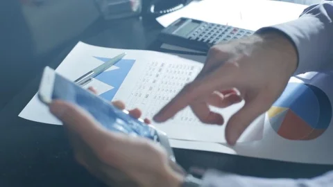 Man checking budget or payroll with phone Видео 72814341