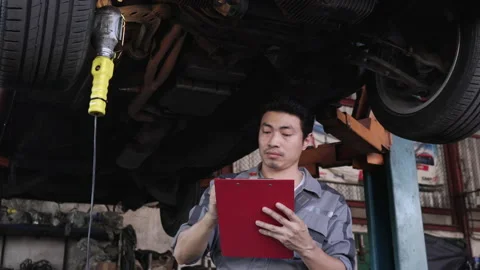 Man checking car Stock Footage 177940609