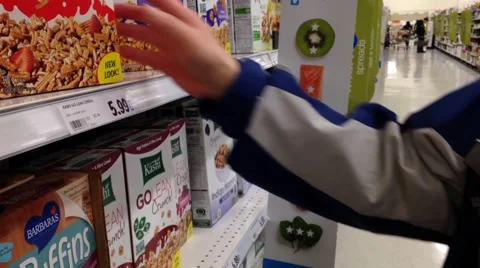 Man checking cereal ingredient in grocery store Stock Footage 47298479