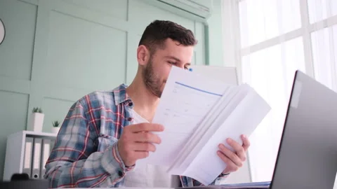 Man checking documents at workplace 库存影片 171543641