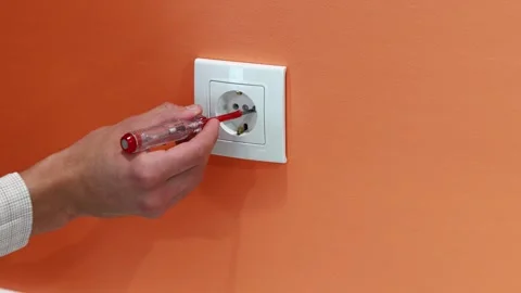Man is checking the electrical outlet. Stock Footage 258620884