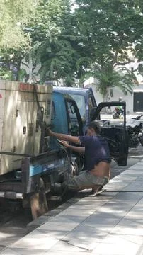 A man checking an electricity generator Stock Photos