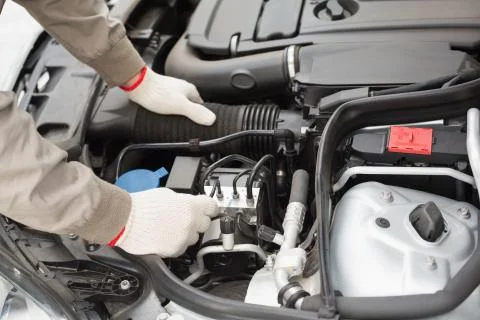 Man checking the engine of his car Stock Photos