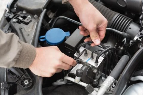 Man checking the engine of his car Stock Photos