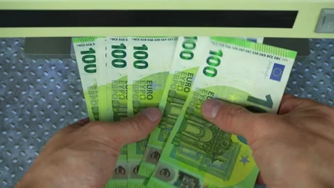 Man checking Euro banknotes with currency detector. Fake money testing 動画素材 291587864