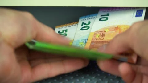 Man checking euro banknotes with currency detector, closeup Video stock 304265597