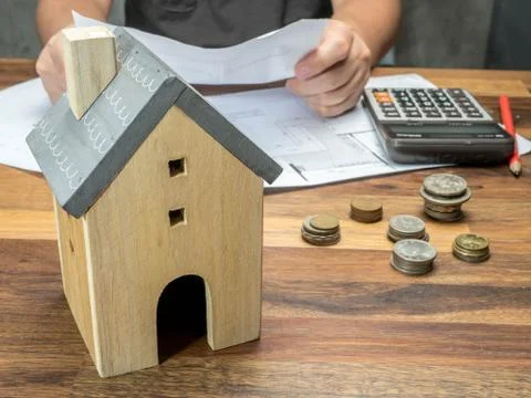 Man checking financial problems with home debt and invoices, Money concept, r Stock Photos