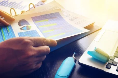 Man checking financial report. Work with business papers in office. Stock Photos