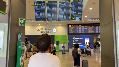 Man checking flight departure information board Видео 344583047