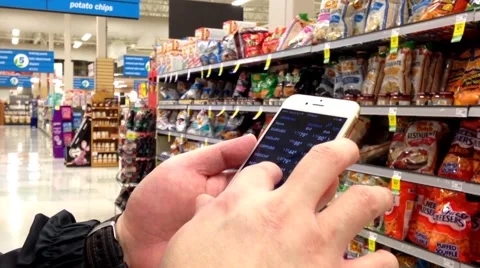 Man checking global exchange rate on iphone Stock Footage 55493417