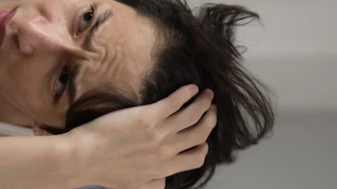 Man checking hairstyle in the mirror Video stock 230207357