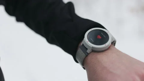 Man checking heart rate on smart watch during run Stock Footage 208657698
