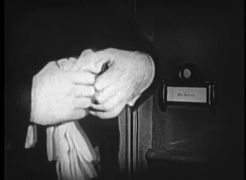 Man checking himself in mirror before ringing door buzzer Stock Footage 260250447
