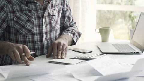 Man checking his bills and managing home finances Stock Footage 103202947