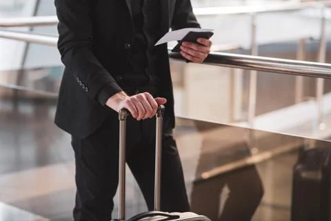 Man checking his boarding pass before the boarding Stock-Fotos