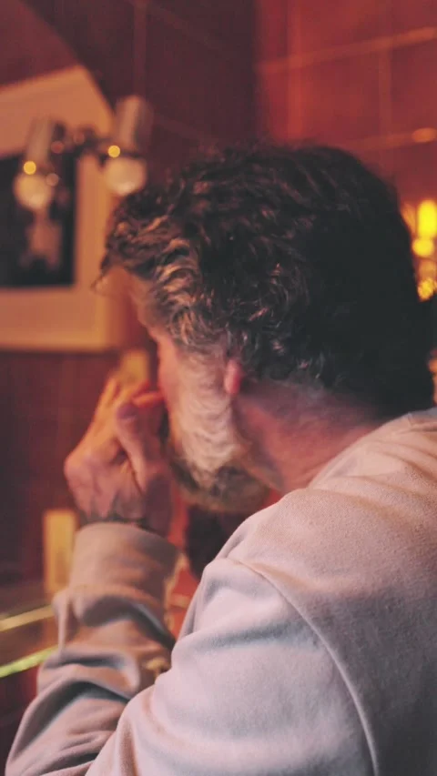 Man checking his face in the mirror Stock Footage 304437288