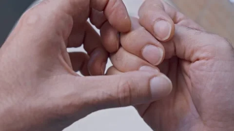 Man checking his fingernails during personal grooming routine Stock Footage 332412714