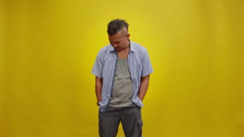 Man Checking His Trouser Pocket and Finding It Empty Stock Footage 336993319