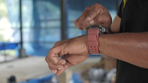 A Man checking his watch  動画素材 243419579