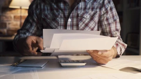 Man checking home finances and bills Stock Footage 103203229