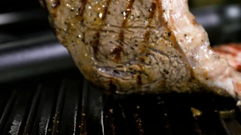 Man is checking if steak is cooked well on the grill Stockbeeldmateriaal 102611071