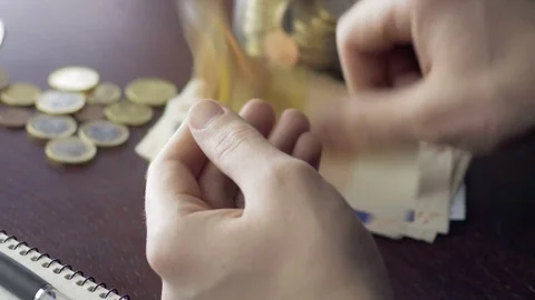 Man checking the income earned from his small business Stock Footage 75460835