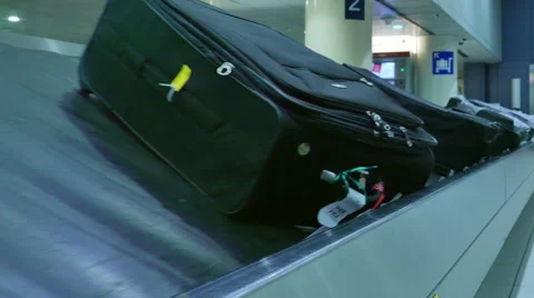 Man checking luggage caroussel Stock Footage 67166889