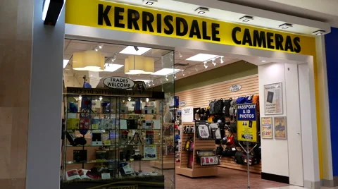 Man checking new camera at Kerrisdale cameras store Video stock 58741855