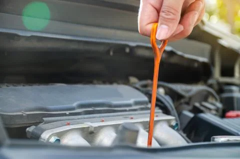 Man checking the oil level in car engine, Check and maintenance the oil level Stock Photos