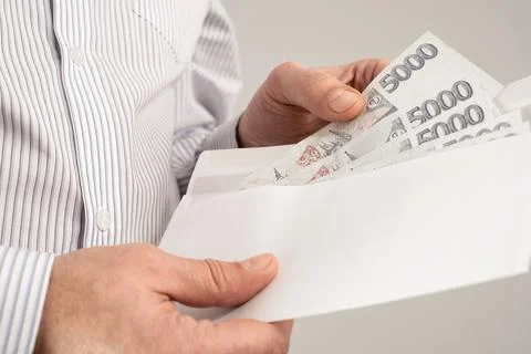 Man Checking Out Envelope With Cash. Czech republic koruna currency. Czechi.. 스톡 사진