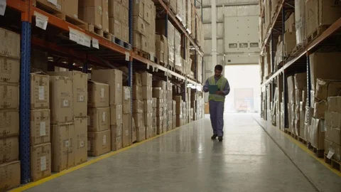 Man checking packages with barcode reader at warehouse. Stock Footage 119360503
