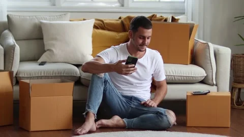 Man checking parcel box with phone and calculator.Concept online seiling. Stock Footage 163088842