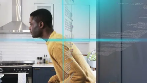 Man checking phone after notification and walking in kitchen, AR code and blue Stock Footage 333670617