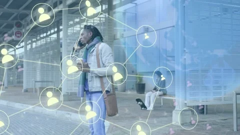 Man checking phone at bus stop, calling while social network web growing over Stock Footage 333911325