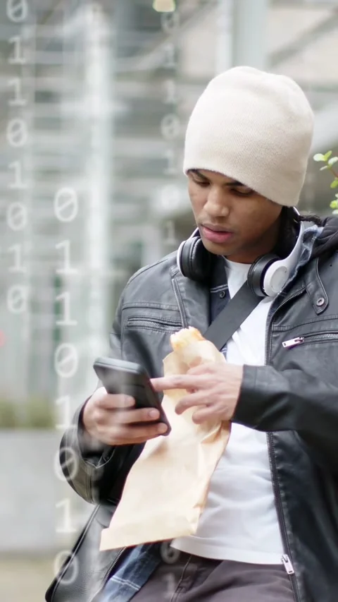 Man checking phone in city, activating tech avatar network and data overlays, Stock Footage 332823248