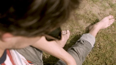 Man Checking Phone Grass Video stock 127036054