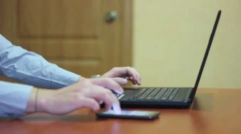 Man checking  phone while working Stock Footage 68293401