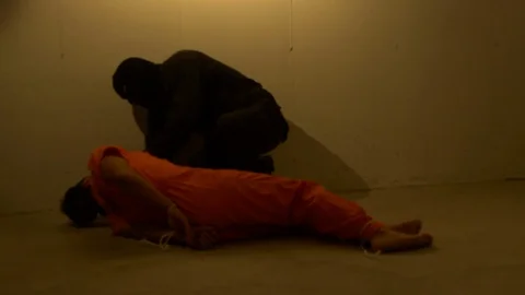 Man checking on prisoners Stock Footage 129477278