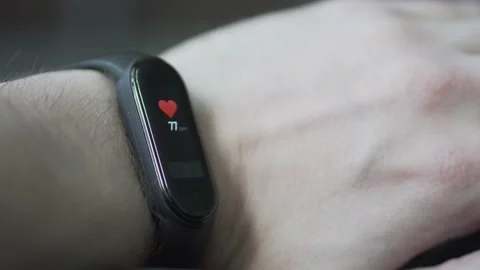 Man checking the pulse on the smartwatch Stock Footage 156588683