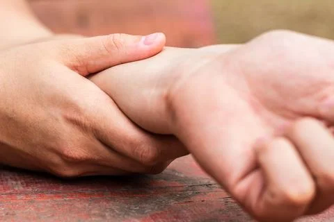 Man checking pulse on wrist Stock Photos