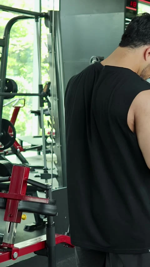 Man Checking Smartphone During Workout in Modern Gym Stock Footage 314712730