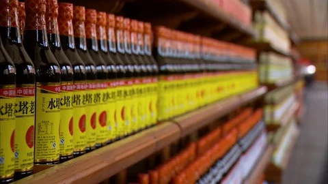 Man checking stock of vinegar bottles in warehouse Stock Footage 88825609